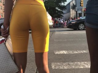 Black girl's thong is visible in orange shorts-6