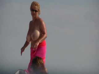 Gigantic mature tits on a beach Voyeur!-5