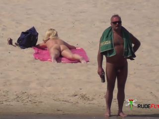 Amateur make fun at a nude beach  2-0