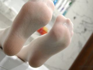 Gentle feet in white stockings plays with soap bubbles Black!-5