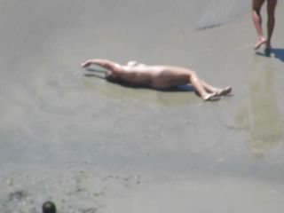 Wacky nudist woman rolls in the  mud-2