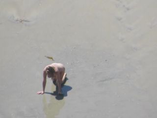 Wacky nudist woman rolls in the  mud-4