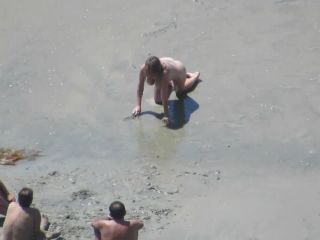 Wacky nudist woman rolls in the  mud-5