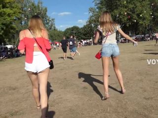 Sexy friends in shorts on a music festival voyeur -0
