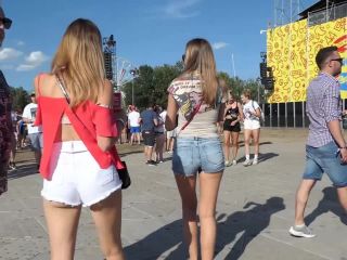 Sexy friends in shorts on a music festival voyeur -8