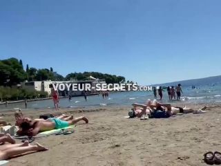 Making out while fingering her pussy on a public beach-8