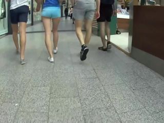 Elegant teen in shorts walks with hipster boyfriend-0