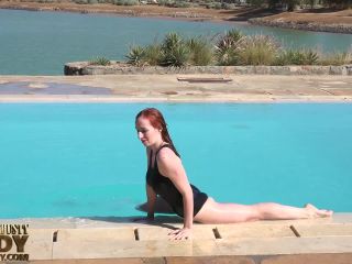 stretching eroticlly outside near the pool-8