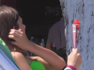 Teen girl sucks on an ice cone-1