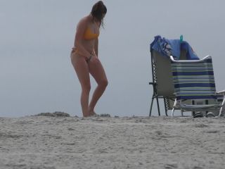 Zooming in on nice ass in very colorful bikini-2