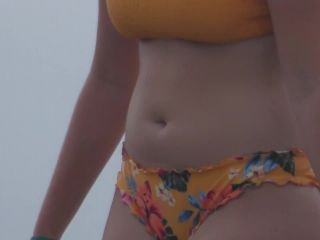 Zooming in on nice ass in very colorful bikini-7