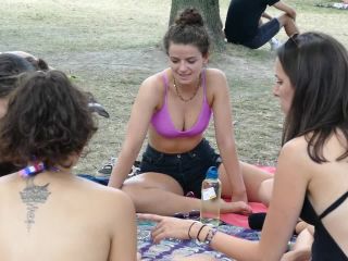 Voyeur zooms in on hippie girl's nice tits-0