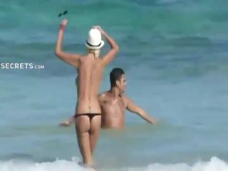 Skinny topless girl enters the water-2