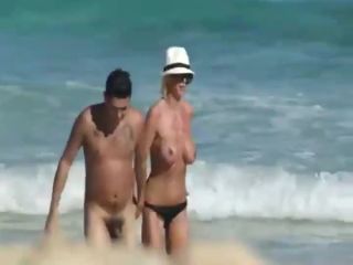 Skinny topless girl enters the water-9