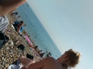 Generous nipple slip caught on the beach-2