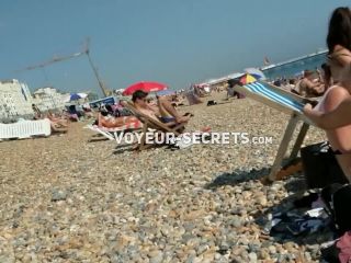 Generous nipple slip caught on the beach-6