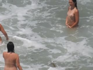 Naked girls having fun in the waves-7