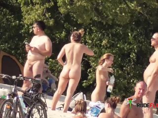 Candid youthful damsel naked on the nude strand in  public!-2