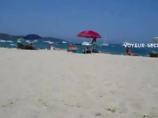 Secret view as she rubs pussy on a beach public -0