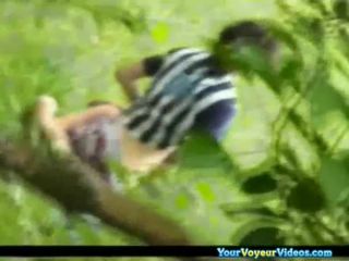 Voyeur hidden in the bushes catches teen couple fucking-0