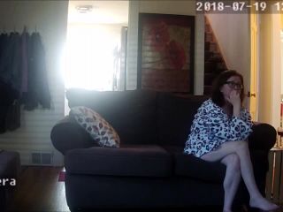 Horny wife watching phone porn and fingering pussy on the couch. hidden cam-1