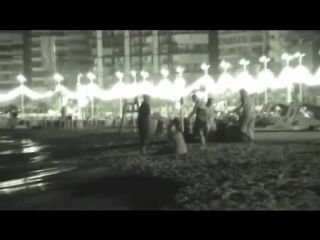 Voyeur films couples at night on a beach-4