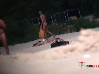Wild brunette teen dances nude at a public beach  3-0