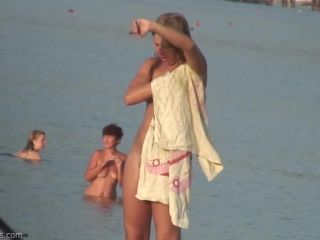 Pretty girl topless on the beach-2