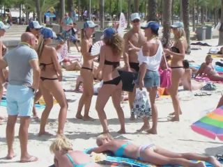 Club promoters dancing on beach-2